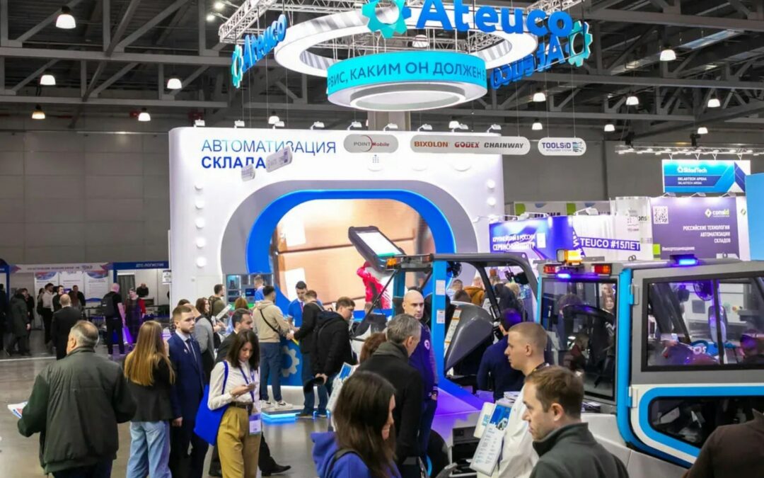 Visitors gathered around an exhibit at a trade expo